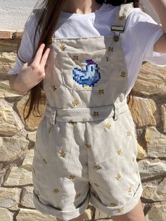 Look no further than with the Stardew Chicken Overalls Shorts! This cute and beautiful overalls is the perfect outfit for the stylish gamer girl. Crafted with care, you'll feel comfortable and look stylish! non-functional pocket Recommendation: The pants are a little short and it is recommended to take one size bigger than usual Material 100% polyester The design is made by embroidery in our workshop. This is an original design by us, Petimint See Shipping policy and Refunds. Jumper Shorts Outfit, Stardew Chicken, Chicken Stardew Valley, Katie Gardner, Overalls Outfit Short, Overalls Aesthetic, Christian Modest Outfits, Overall Shorts Outfit, Cute Pastel Outfits