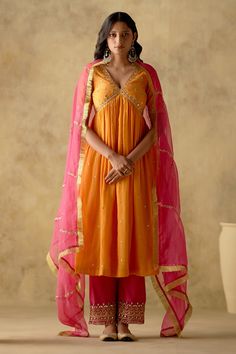 Tangerine anarkali with mirror, resham and dabka embroidery. Paired with embroidered palazzo and dupatta. Components: 3 Pattern: Embroidered Type Of Work: Floral Neckline: V neck Sleeve Type: Half Fabric: Anarkali and Palazzo: chanderi silk lined with mul cotton, Dupatta: Organza Color: Orange Other Details:  Gathered detailing Fringe detailing Attached lining Yoke embroidered Occasion: Wedding - Aza Fashions Orange Anarkali, Dabka Embroidery, Anarkali Suits Designer, Dabka Work, Silk Anarkali Suits, Silk Anarkali, Trendy Outfits Indian, Simple Frocks, Anarkali Dress Pattern