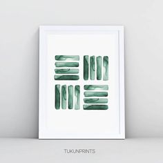 a green watercolor print with the words tuknurnits on it in white frame