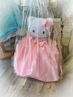 a hello kitty stuffed animal in a plastic bag