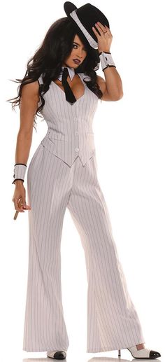 a woman dressed in a pinstripe suit and hat