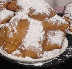 powdered sugar covered pastries are on display