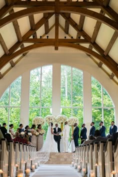 a bride and groom standing at the end of their wedding ceremony