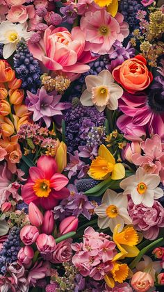 an array of colorful flowers are arranged together