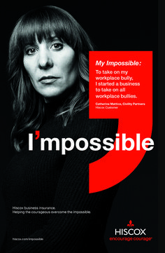 a woman with long hair standing in front of a black and red poster that says i impossibleible