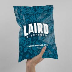 someone holding up a bag of food that says lardo superfood on it