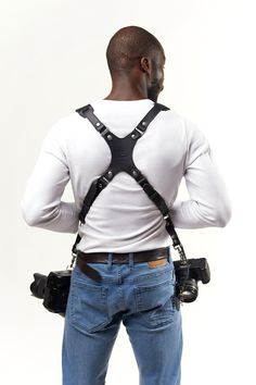 NEW DESIGN 1in wide skinny version of our dual harness with padded shoulder to give you same amount of support. This Multi Cameras Harness completely handmade and originally designed is suitable for everything all day weddings and studio shoots, travel and wildlife photography and sporting events. The Camera Harness is made of real high quality leather and holds two cameras comfortably at your hips and. The Speed Clutch mechanism allows the camera to slide along the harness to eye level easily. Black Harness With Belt Loops For Everyday Use, Black Adjustable Belts And Suspenders For Everyday Use, Camera Harness, Studio Shoots, Leather Camera Strap, S Aesthetic, Brown Fits, Information Processing, Camera Straps