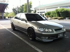 a silver car parked in a parking space