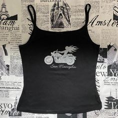 This Graphic Tank Top From Star Motorcycles Is Amazing! It’s Deadstock/Brand New With Tags From The Early 2000s/Y2k. It’s Black And Has A Silver Glitter Graphic Of A Woman Riding A Motorcycle On The Front. The Glitter Has Some Fallout, So Beware Of That. It’s In Great Condition With No Rips, Stains, Or Tears. Tagged As A Large Measurements Bust (Underarm To Underarm): ~15.5 In Flat/31 In Bottom Opening: ~15.5 In Flat/31 In Length (Shoulder To Bottom): ~21 In Y2k Graphic Tank Top, Silver Tank Top, Star Motorcycles, Tank Top Y2k, Riding A Motorcycle, Lululemon Align Tank, Purple Tank, Tunic Tank Tops, Back Women