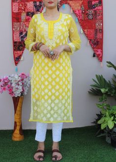 Kurti Details: Fabric: Faux Georgette Color: Sunshine Yellow Length: 44 inches Size Avl: 36 to 44 Inches bust Sizes Work: Hand Chikankari with Booti Jaal  Chikankari embroidery Packet Contain: Kurti- Pant and Matching Inner This yellow Kurti is made with soft and lightweight Georgette Fabric. Gorgeous Kurta is embellished by floral motifs Chikarkari work to cover its lustrous look. Select a matching White Pant from our Nupur bottom collections. Pant Details: fabric: Lycra Cotton Length: 37 Pocke Yellow Georgette Sets With Chikankari Embroidery, Traditional Palazzo Set With Dabka Work For Puja, Traditional Yellow Palazzo Set With Self Design, Traditional Yellow Self-design Palazzo Set, Fitted Yellow Churidar With Chikankari Embroidery, Bollywood Chikankari Embroidery Sets For Puja, Fitted Self Design Palazzo Set For Puja, Yellow Churidar With Resham Embroidery For Puja, Fitted Self-design Palazzo Set For Puja