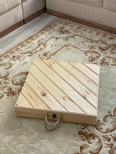 a piece of wood sitting on top of a rug