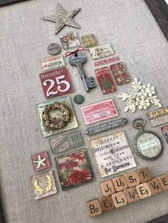 a christmas tree made out of scrabbles and magnets on a table