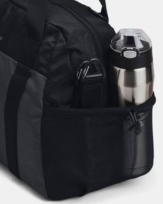 the back pack is packed and ready for someone to take their water bottle or coffee