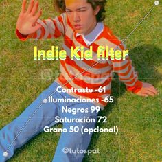 a young man sitting on the grass with his hands up in front of him and an advertisement for india kid filter