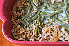 green beans and shredded meat in a red casserole dish