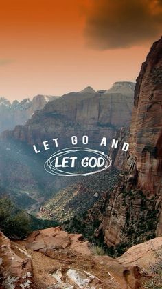 an advertisement for let go and let god on the side of a mountain with mountains in the background