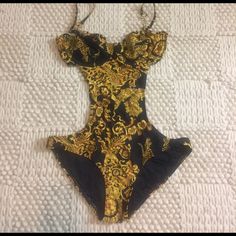 Gold And Black Monokini. New With Tags Never Been Worn. Runs Small. Lowballs Will Not Be Accepted If It’s Listed It’s Available No Modeling/Holds Chic Gold Stretch Swimwear, Elegant Gold Stretch Swimwear, Luxury Gold Swimwear For Party, Gold Lined Swimwear For Party, Gold Fitted Swimwear With Lined Body, Luxury Fitted Swimwear For Summer, Fitted Gold Swimwear With Lined Body, Luxury Fitted Black Swimwear, Luxury Gold Swimwear For Summer