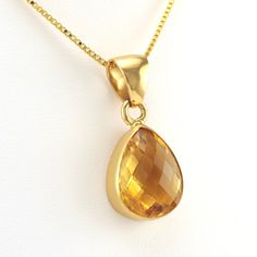 This genuine checkerboard cut citrine teardrop gemstone is set in alchemía. Pendant is 1 3/8 inches long and 5/8 inch wide and is sold separate from the 18k gold fill 1.2mm box chain shown. Alchemía a blend of base metals that looks like 18k gold and will not change color and is hypoallergenic. Style Number: 19201 Metal: Alchemía Gemstone: Genuine Citrine Dimensions: 1 3/8 inches long and 5/8 inch wide Handmade in Mexico Teardrop Citrine Gemstone Jewelry, Amber Teardrop Birthstone Jewelry, Teardrop Faceted Citrine Jewelry, Faceted Teardrop Citrine Jewelry, Pear-shaped Citrine Jewelry In Yellow Gold, Yellow Gold Pear-shaped Citrine Jewelry, Faceted Briolette Citrine Jewelry, Gold Citrine Drop Jewelry, Faceted Teardrop Pendant In Yellow Gold