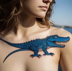 a woman with a blue alligator tattoo on her chest