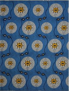 a blue background with yellow and white flowers on it's edges, in the center is an intricate design