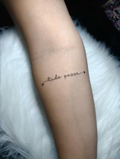 a person with a tattoo on their arm that says,'little passion'in cursive writing