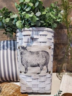 a basket with some plants in it on a table