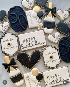 decorated cookies with happy birthday written on them are arranged in the shape of hearts and balloons