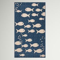 a blue rug with white fish on it