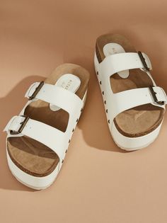 Step into summer with confidence in these sandals! They're not just footwear, they're a style statement in every stride and a new go-to for any outfit. Summer Slip-on Mules With Buckle Closure, Casual Slip-on Wedge Sandals With Buckle, Trendy Spring Mules With Round Toe, Summer Slip-on Synthetic Flip Flops, Synthetic Open Toe Mules With Cushioned Footbed, Trendy Summer Slip-on Clogs, Adjustable Trendy Wedge Sandals For Summer Outings, Trendy Adjustable Wedge Sandals For Summer Outings, Vacation Slip-on Clogs With Cushioned Footbed