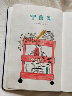 an open notebook with a drawing of a flower pot on top and the words tbr written in it