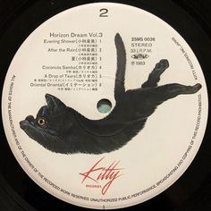 the label for kitty's love trip shows a black cat laying on its back