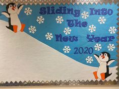 a bulletin board with penguins and snowflakes on it that says sliding into the new year