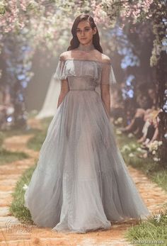 Sweeping ball gowns fit for princesses. Ethereal silhouettes hand-embroided with woodland scenes. Pretty dresses that will get you bursting into song. Details that Arwen Inspired Dress, Paolo Sebastian Runway, Elegant Evening Gowns Classy, Paolo Sebastian Wedding Dress, Disney Wedding Dresses, Fairy Tale Wedding Dress, Trendy Wedding Dresses, Wedding Dress Couture