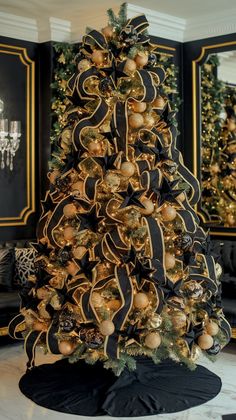 a black and gold christmas tree in a living room