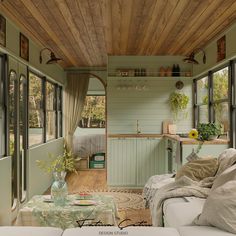 a living room filled with furniture and lots of windows