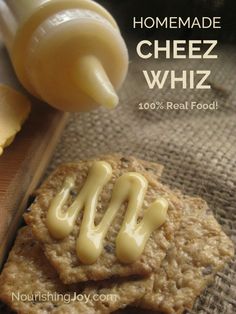 homemade cheez whiz crackers are being drizzled on