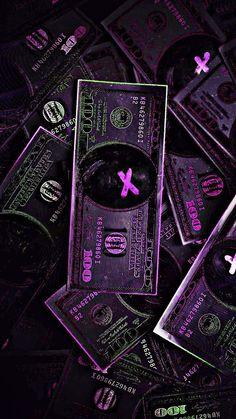 a pile of money sitting on top of each other in front of a purple background