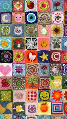 a colorful crocheted blanket with many different designs