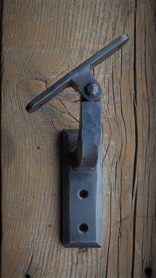 an old door handle on a wooden door