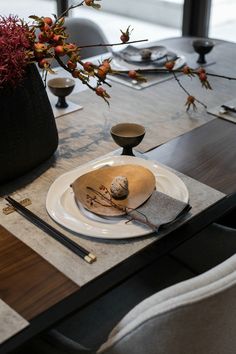 a table set with plates and place settings