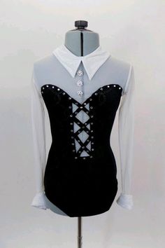 a black and white corset on a mannequin