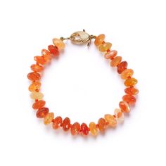 Fiery orange carnelians finished with our cheeky lobster clasp. Length 7". Ships within 5 business days. Amber Carnelian Bracelets With Round Beads, Amber Carnelian Round Beaded Bracelets, Orange Carnelian Bracelets With Natural Stones, Amber Carnelian Beaded Bracelets With Round Beads, Orange Agate Gemstone Bracelets, Adjustable Carnelian Gemstone Beaded Bracelet, Amber Carnelian Gemstone Bracelets, Carnelian Beaded Bracelets With Gemstones, Carnelian Gemstone Beaded Bracelets