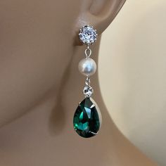 Long Green Earrings Emerald Green Rhinestone Earrings Pear Shape with Swarovski Pearl wedding bridal jewelry These Bridal Earrings in Emerald Green Crystal Rhinestone are so pretty with a Long Green Pear Shaped Drop that measures a total of 2 inches long. Made with a Swarovski Pearl in your choice of color either White (shown) or Cream Ivory, these also have a CZ Rhinestone post on the top. Comes in a Gift Box and ready to give. Perfect wedding bridal or gift! To see more Bridal Wedding Jewelry Green Teardrop Pearl Earrings For Wedding, Green Crystal Bridal Earrings For Wedding, Green Crystal Rhinestone Earrings For Wedding, Green Rhinestone Crystal Earrings For Wedding, Wedding Green Crystal Rhinestone Earrings, Emerald Green Crystal, Emerald Green Earrings, Earrings Emerald, Wedding Bridal Jewellery