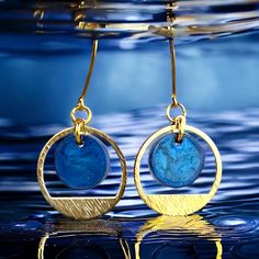 "These blue and gold dangles are just as versatile as they are beautiful! Delicate and lightweight, but oh so stunning! Equally at home in the office or out on the town-the perfect touch for jeans and a tee, or take that little cocktail dress to the next level.  They would be a lovely choice for bridesmaids as well. I'm always happy to make custom orders in any color, however many you might need. Just message me and we can make it happen! 🔵Ear wires and metal components are lead safe and nickel Special Occasion Jewelry, Jewelry Bridesmaid, Etsy Bridesmaid Gifts, Blue And Gold, Gold Plated Earrings, Large Bag, Make It Happen, Bridesmaid Gift, Ear Wires