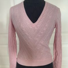 Beautiful Paw Pink Cashmere Sweater. Excellent Pre Owned Condition Elegant Cable Knit Cashmere Tops, Long Sleeve Cashmere Cable Knit Top, Long Sleeve Cable Knit Cashmere Top, Cable Knit Cashmere Long Sleeve Top, Fitted V-neck Cashmere Top, Fitted V-neck Cashmere Sweater, Fitted Wool V-neck Sweater, Classic Pink Winter Tops, Fitted Cashmere Tops For Winter