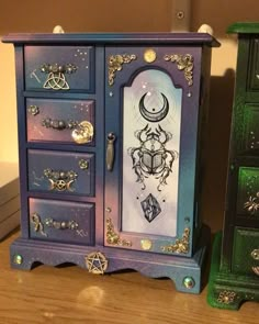 a purple and blue cabinet with jewelry on it