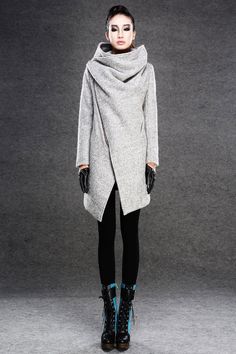 This asymmetrical gray wool coat offers a lot of warmth and comfortable style with the funky asymmetrical front zipper closure. The large cowl neck collar is sure to keep you cozy and warm too. The pale gray is a great color that will go with absolutely every piece of clothing you own. Updated with a modern twist, this asymmetrical front zipper winter coat is a lustrous utility jacket to keep you one step ahead of the weather. With the snug-as-a-bug cowl neck and deep side/front pockets, this wi Asymmetrical Coat, Scene Girl, Gray Wool Coat, Boucle Coat, Wool Winter Coat, Wool Coat Women, Winter Mode, Womens Jackets, Winter Outerwear