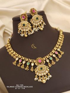 Description :- Traditional Long Necklace Sets Antique Gold-Plated Choker and Earrings Indian Jewelry Set White Red Green  Gift yourself a royal look with this perfectly crafted kundan necklace set from Manalisstudio. Crafted with high quality kundan stones and pearls, it is impressive in design. The green enamel artwork adds perfect texture to the design. Perfect for weddings and festivities, this antique necklace set should be put on with your favorite sari or lehenga. 100% Satisfaction. Long L Temple Jewelry Sets With Matching Earrings For Wedding, Temple Jewelry Necklace With Matching Earrings For Wedding, Temple Jewelry Sets For Wedding, Wedding Temple Jewelry Sets With Matching Earrings, Traditional Bridal Necklace With Matching Earrings For Anniversary, Ornate Multicolor Jewelry For Wedding, Elegant Meenakari Jewelry Sets For Marriage, Ornate Multicolor Necklaces For Weddings, Ornate 22k Gold Kundan Wedding Necklace