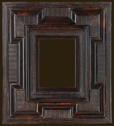 an old wooden frame with a black background