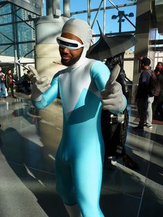 a man dressed in a blue and white costume